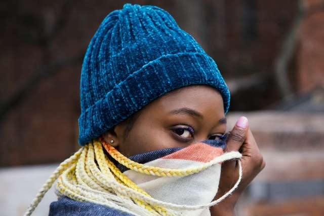 a girl stealing glance with her mouth covered