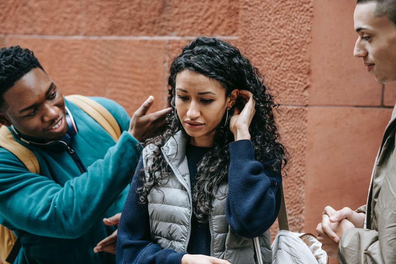 a girl trying to ignore a man talking with her 