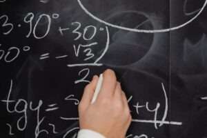 calculating on a black board