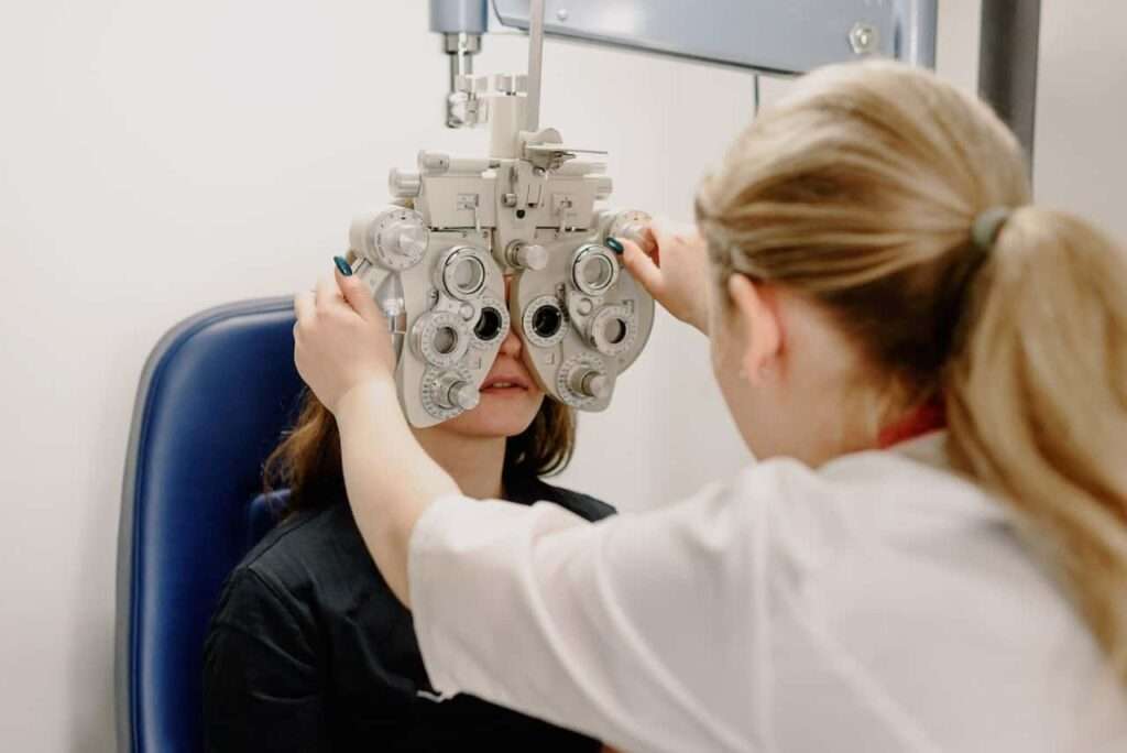 ophthalmologist checking vision of patient.